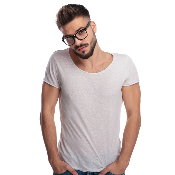 Shy young casual man wearing glasses — Stock Photo, Image