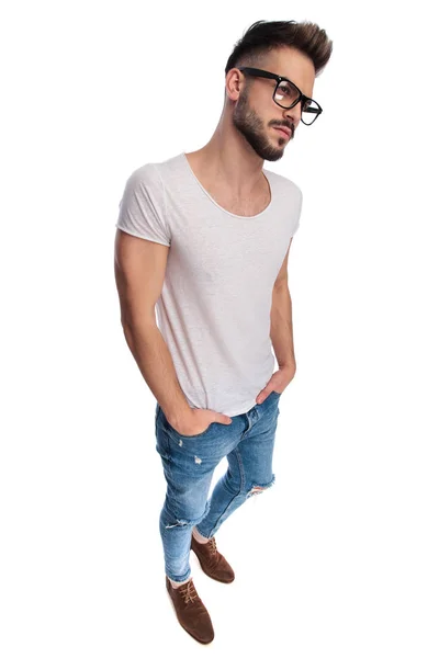Side view of a casual man with  hands in pockets — Stock Photo, Image