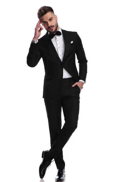 Elegnat man in tuxedo making a military salute — Stock Photo, Image