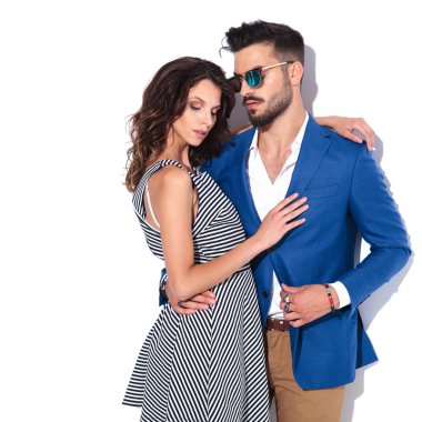 sexy young romanting couple standing embraced  clipart