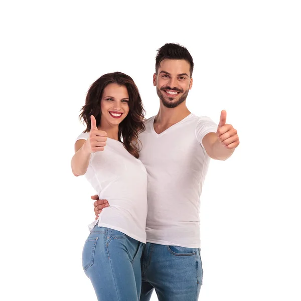 Happy young casual couple making ok sign — Stock Photo, Image