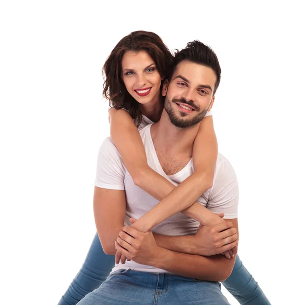 Casual woman behind her seated man smiling — Stock Photo, Image