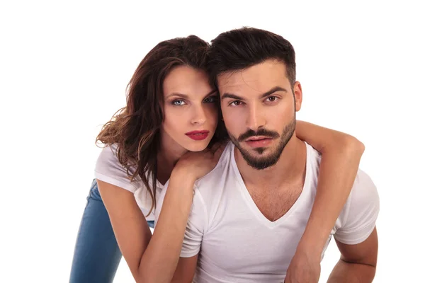 Young casual woman leaning on her man — Stock Photo, Image