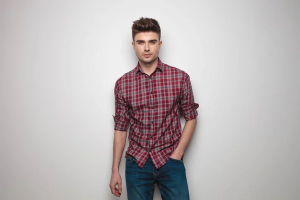 Handsome young man with red checkers shirt and rolled sleeves — Stock Photo, Image