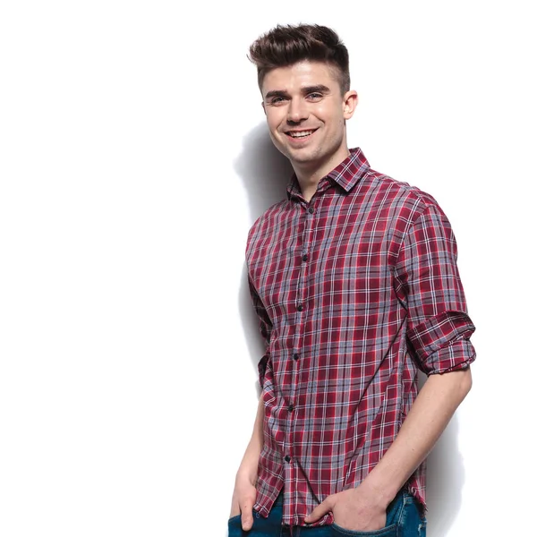 Happy relaxed man wears red checkers shirt with rolled sleeves — Stock Photo, Image
