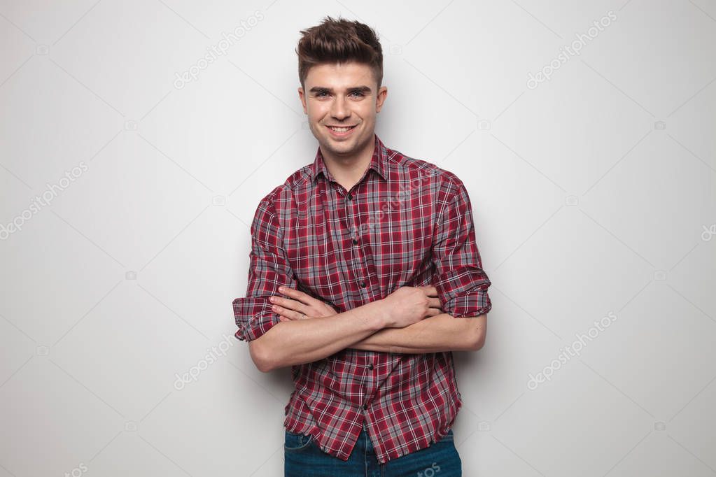 portrait of confident young man with red checkers shirt