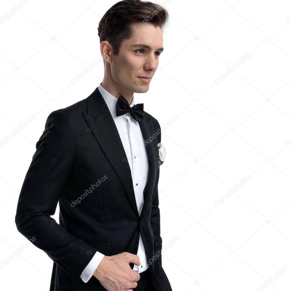 side view of young elegant man looking to side