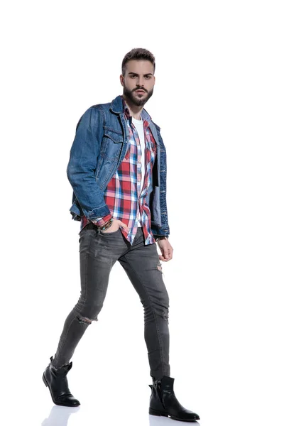 Sexy fashion guy wearing plaid shirt and jeans jacket — Stock Photo, Image