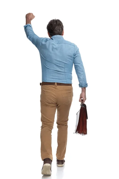 Rear view of a positive casual man celebrating — Stock Photo, Image