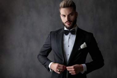 businessman standing and opening jacket with class