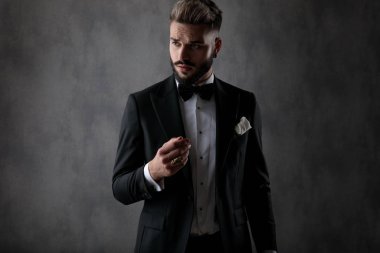 businessman standing with hand folded and posing cool