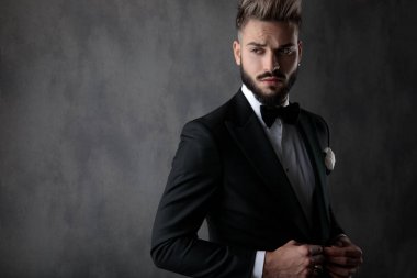 businessman standing one way and looking the other cool