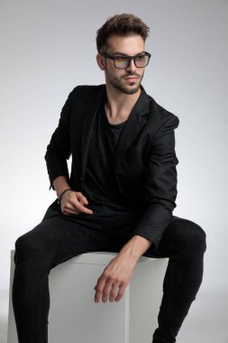 sexy cool guy wearing black coat and sunglasses