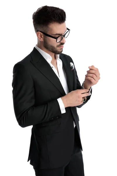 Business man fixing and looking at sleeve serious — 图库照片
