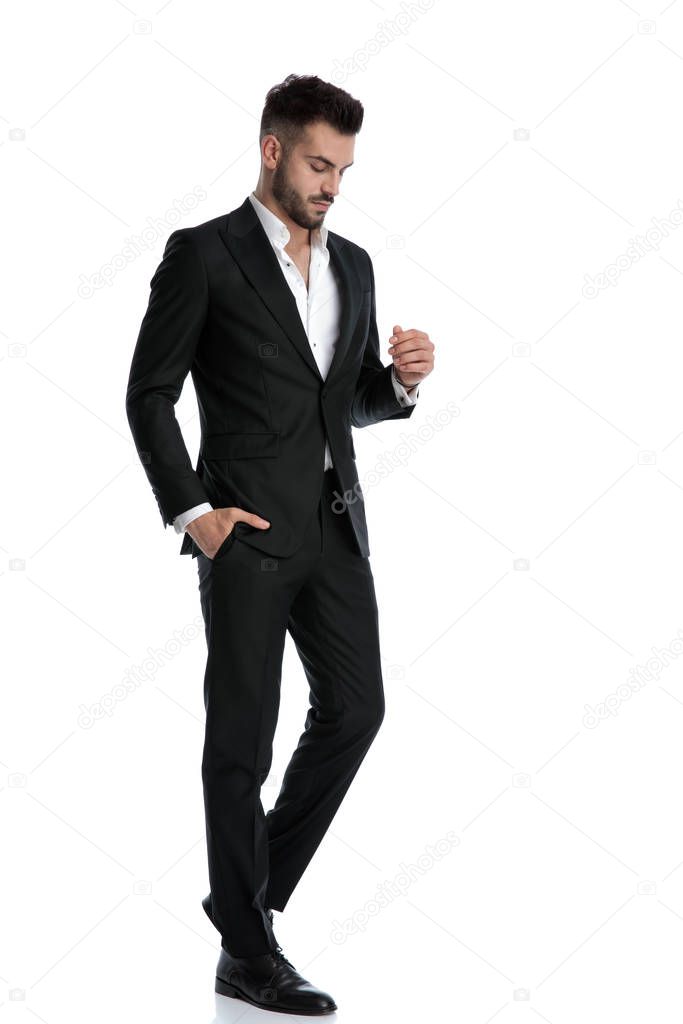 businessman walking with hand in pocket and closed eyes