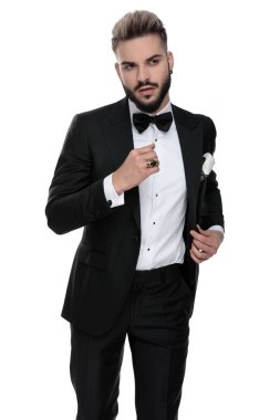 businessman standing with hand folded and grabbing jacket cool