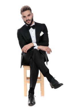 businessman sitting with both arms and legs crossed