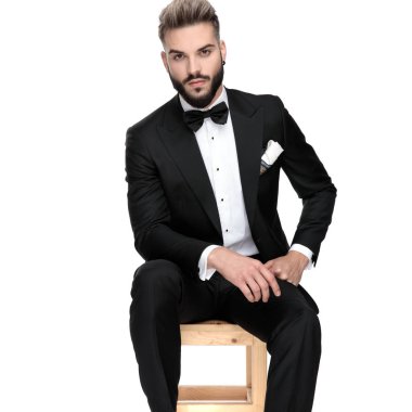 businessman sitting and resting hands in forehand and in fist