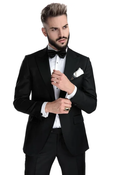 Businessman standing and fixing sleeve cool — Stockfoto