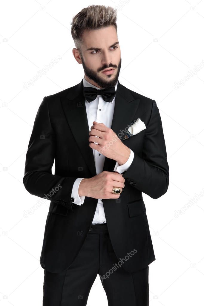 businessman standing and fixing sleeve cool