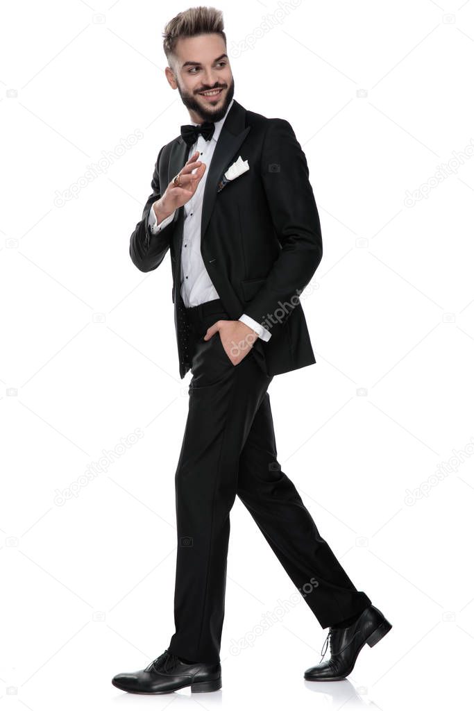 businessman walking one way while saluting someone the other way