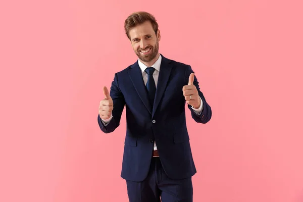 Confident businessman giving a double thumbs up and laughing — Stock Photo, Image