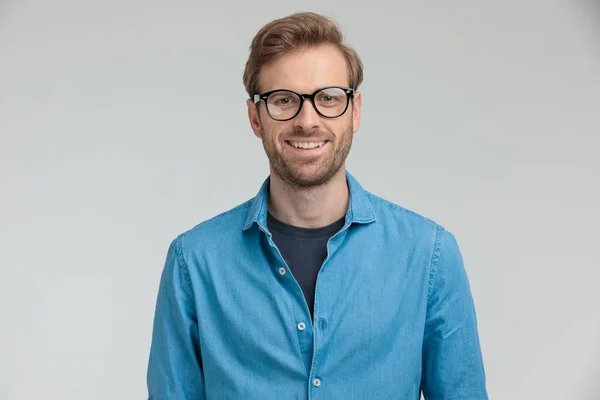 Happy young model wearing glasses and smiling — Stock Photo, Image