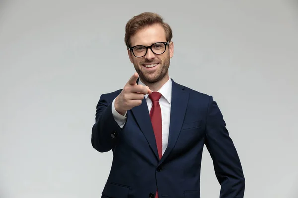 Businessman standing and pointing forward happy — Stockfoto