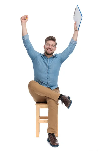 Excited casual man holdings arms in the air and celebrating — Stok fotoğraf