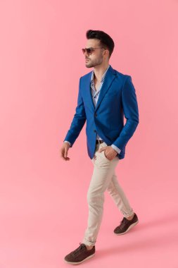 dramatic smart casual guy walking in a fashion pose