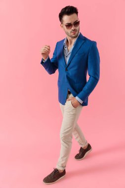 dramatic smart casual guy walking and looking to side