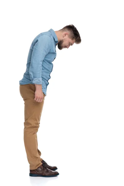 Side View Eager Casual Man Curiously Looking Standing White Studio — Stock Photo, Image