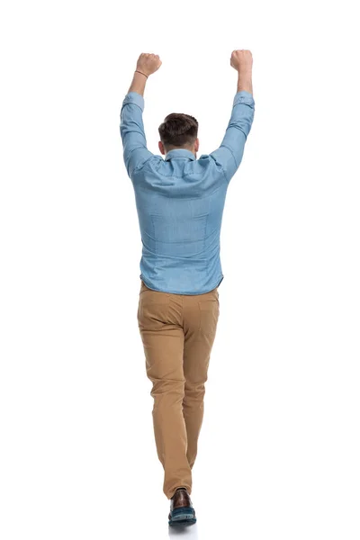 Rear View Celebrating Casual Man Walking White Studio Background — Stock Photo, Image