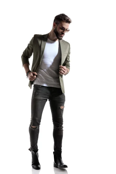 Thoughtful Fashion Model Adjusting His Jacket While Wearing Sunglasses Standing — Stock Photo, Image