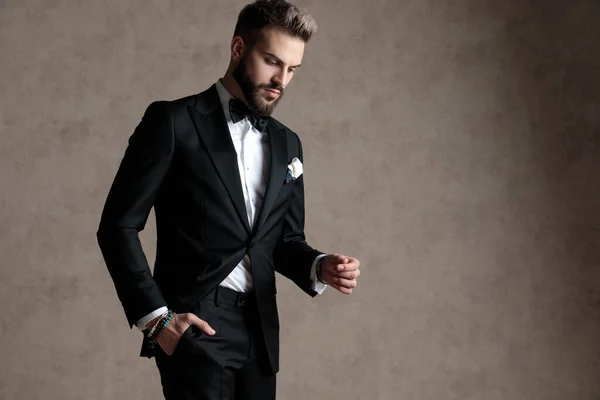 Thoughtful Groom Holding His Hand His Pocket While Wearing Tuxedo — Stock Photo, Image