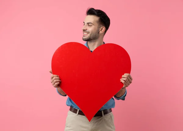 Happy Young Guy Smiling Holding Big Red Heart Standing Pink — Stock Photo, Image