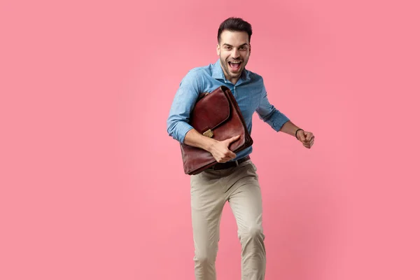 Excited Young Guy Denim Shirt Holding Suitcase Running Pink Background — Stock Photo, Image