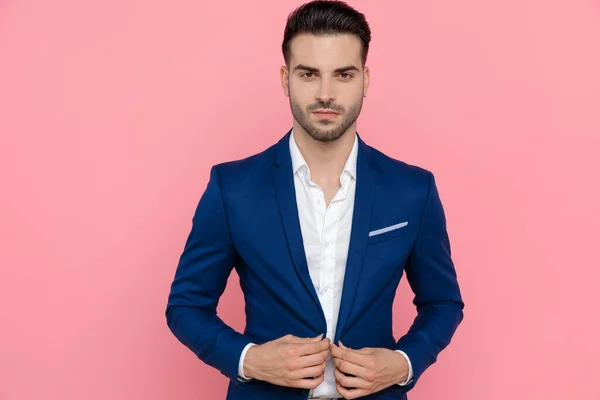 Confident Businessman Adjusting His Jacket While Wearing Blue Suit Standing — Stock Photo, Image