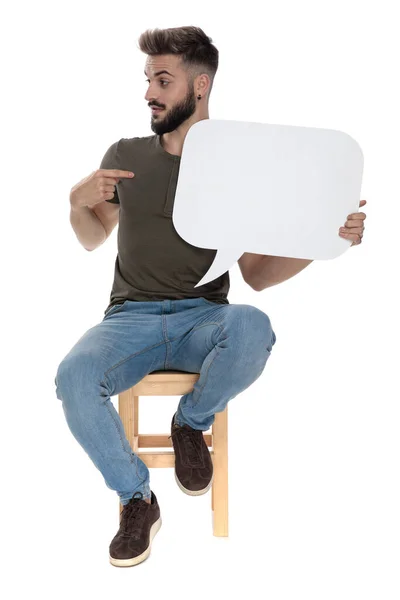 Handsome Casual Man Holding Blank Speech Bubble Pointing Sitting Chair — Stock Photo, Image