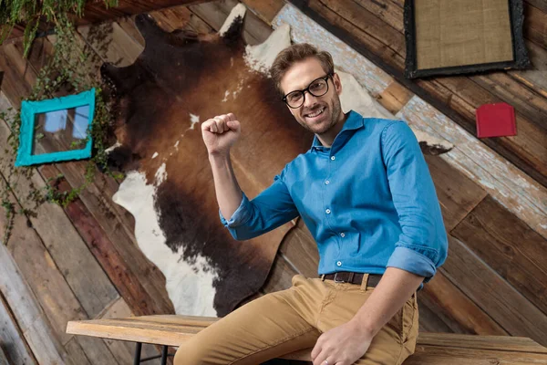 Cheerful Model Celebrating His Fist Air While Wearing Blue Shirt — Stock Photo, Image