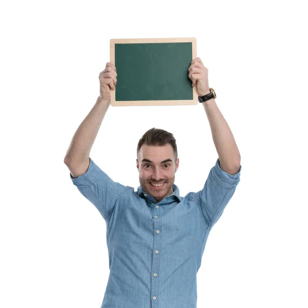 Happy Casual Man Holding Green Blackboard His Head Smiling While — Stock Photo, Image