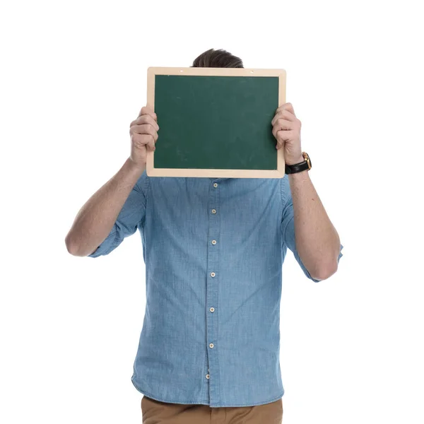 Young Casual Man Covering His Face Green Blackboard While Wearing — Stock Photo, Image
