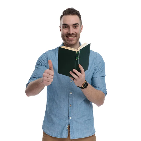 Positive Casual Holding Book Giving Thumbs Smiling While Wearing Blue — Stock Photo, Image