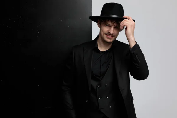 Positive Fashion Model Fixing His Hat Greeting While Wearing Suit — Stock Photo, Image