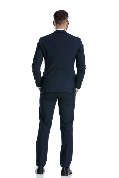 Rear View Businessman Wearing Navy Suit Standing Hands Pocket Looking — Stock Photo, Image