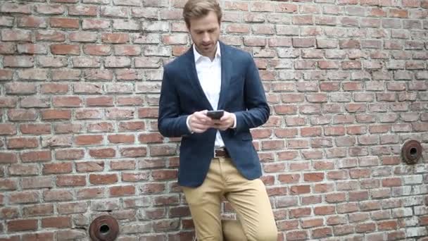 Handsome Blond Businessman Wearing Navy Suit Writing Message His Phone — Stock Video