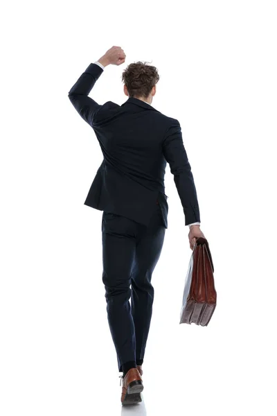 Rear View Businessman Celebrating Holding Briefcase While Wearing Suit Walking — Stock Photo, Image