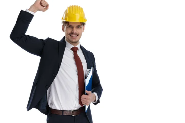 Cheerful Businessman Holding Clipboard Celebrating While Wearing Construction Helmet Suit — Stock Photo, Image