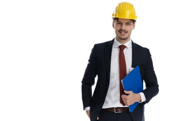 Positive Businessman Holding Clipboard While Wearing Construction Helmet Suit Standing — Stock Photo, Image