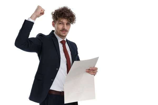 Positive Businessman Holding Newspaper Celebrating While Wearing Suit Standing White — Stock Photo, Image